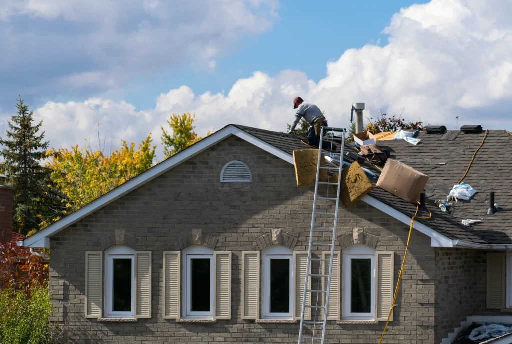 large house roof repair by crew