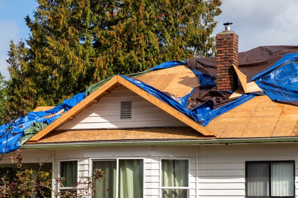 Blue tarps cover roof for protection for damage roof
