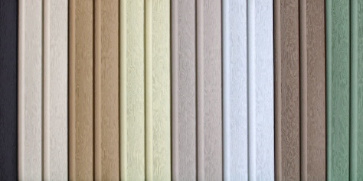 Vertical rows of wood panels display various neutral tones, including shades of beige, cream, white, taupe, and sage green. The panels showcase a smooth texture and subtle wood grain patterns.