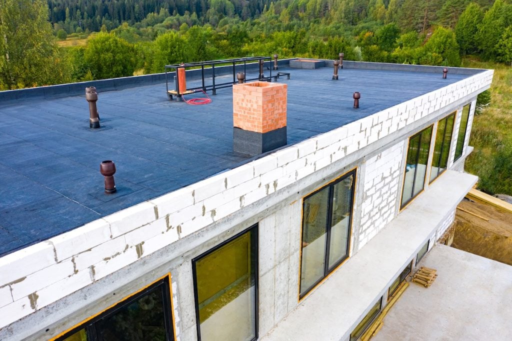 A flat roof of a modern building under construction