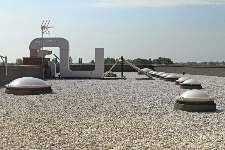 Flat Roof With Gravel and Skylight Windows