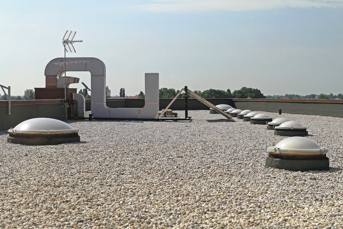 Flat Roof With Gravel and Skylight Windows