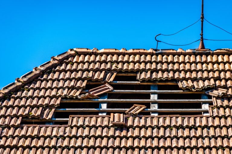 Damaged tile roof after storm