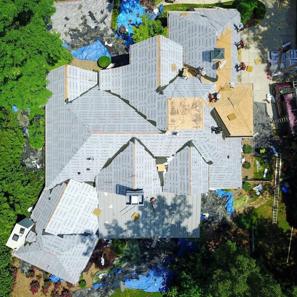 slate roof repair Roof Medic workers repairing shingles