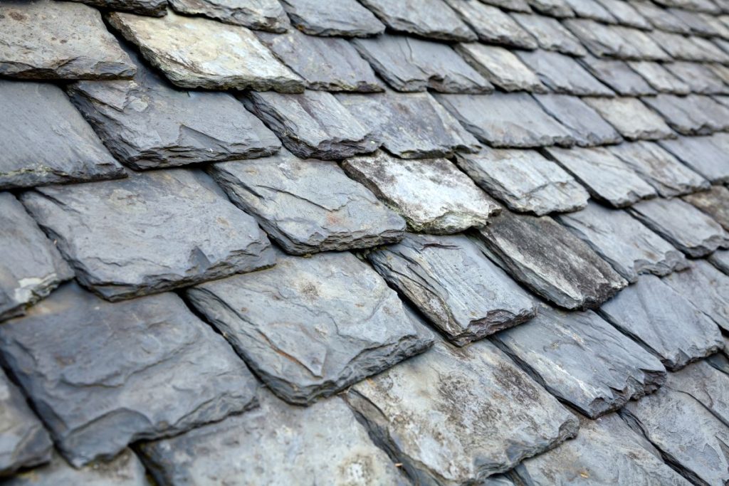 Aged slate tile roof background
