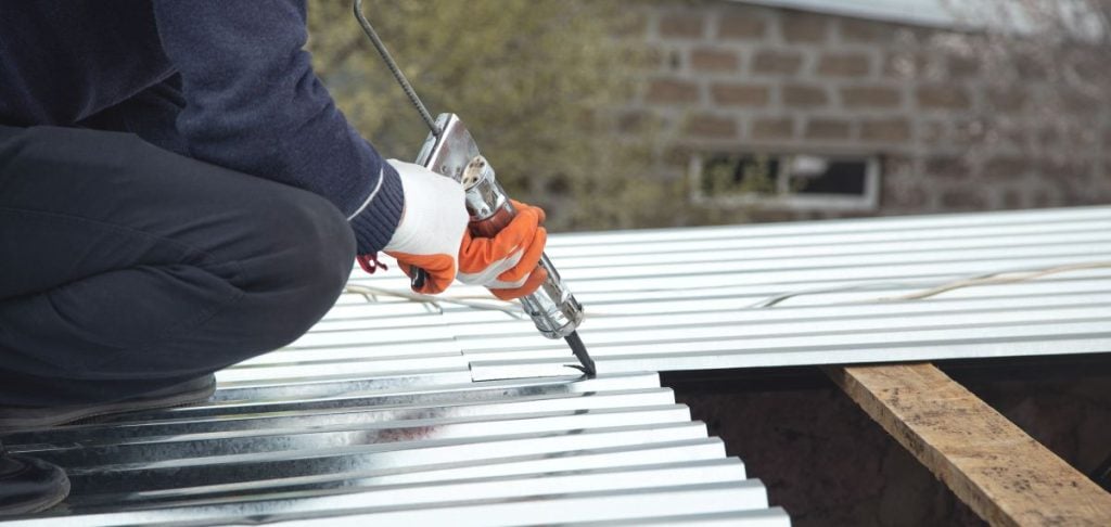 a metal roof sealant being applied