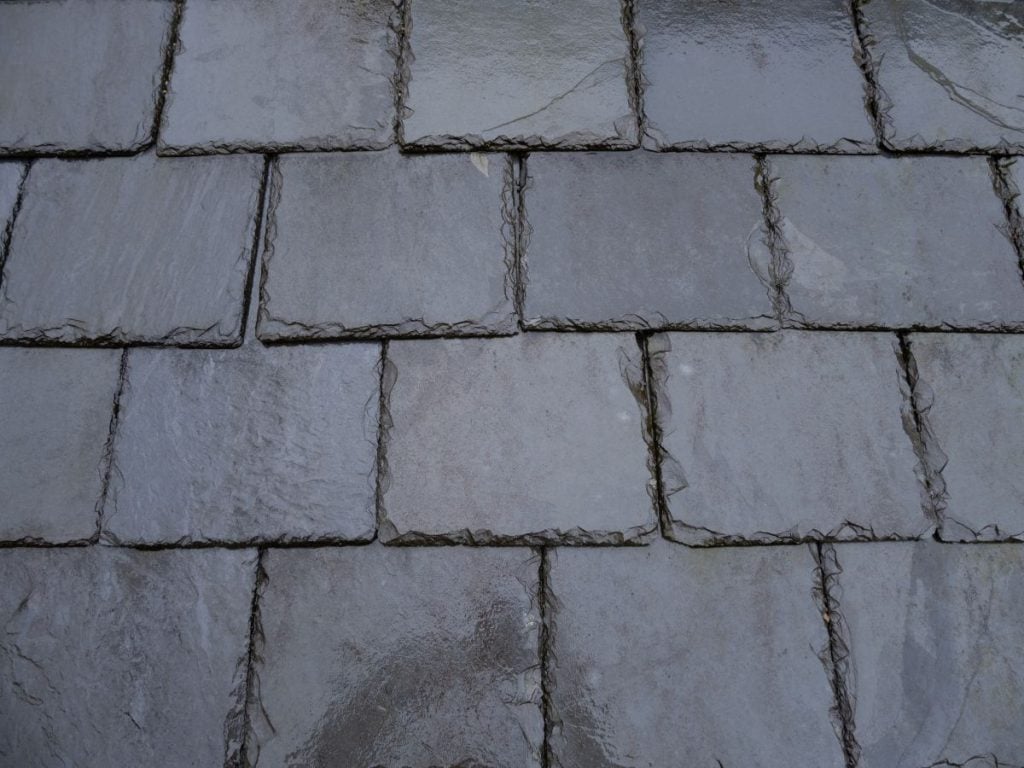 close-up of a roof with grey slate tiles